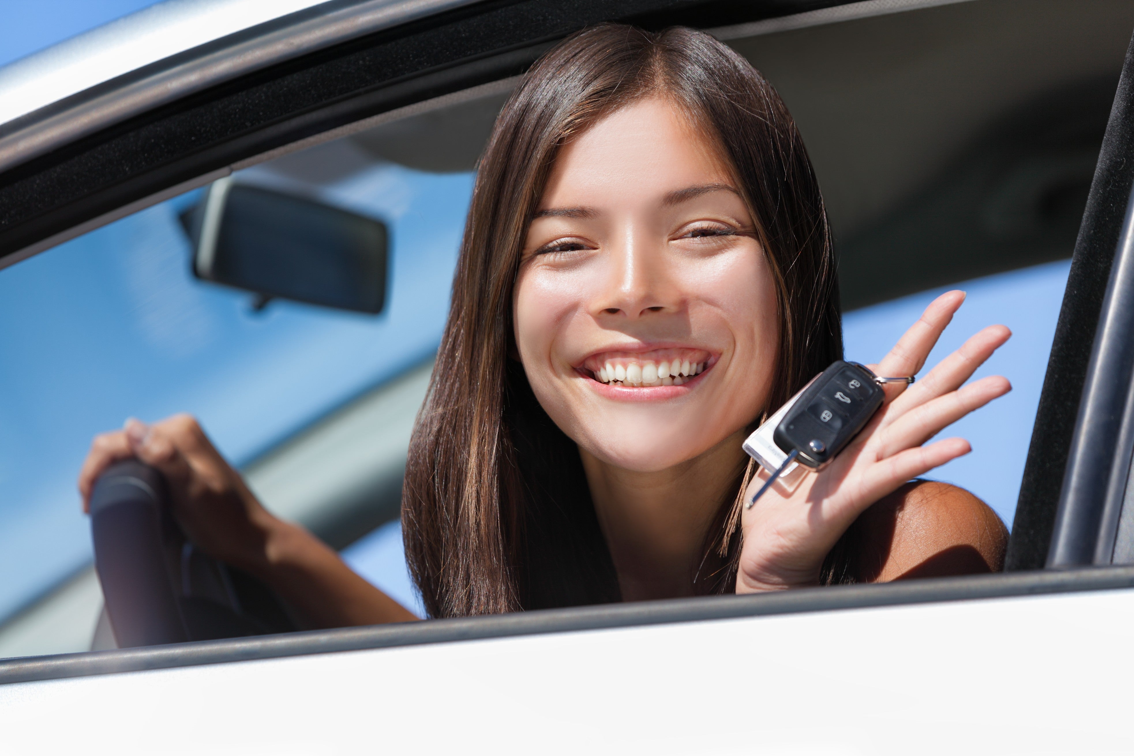 Teen driver holding car keys